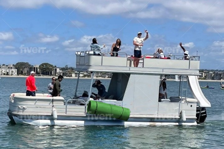 a group of people on a boat in the water