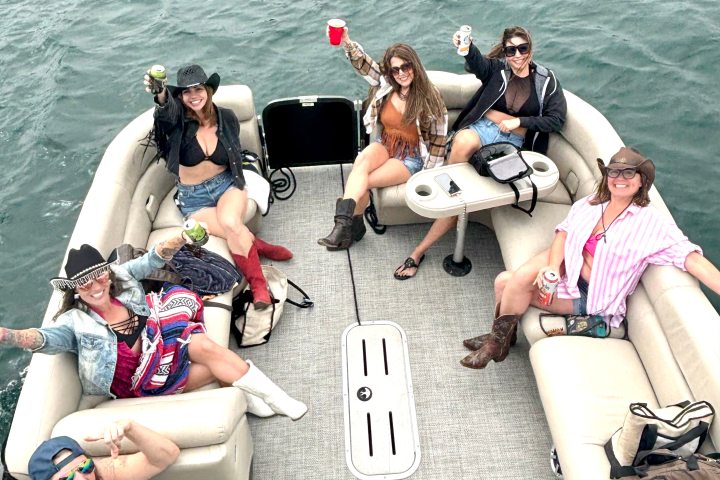 a group of people on the pontoon