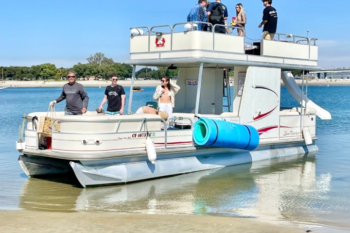 a group of people on a boat in a body of water